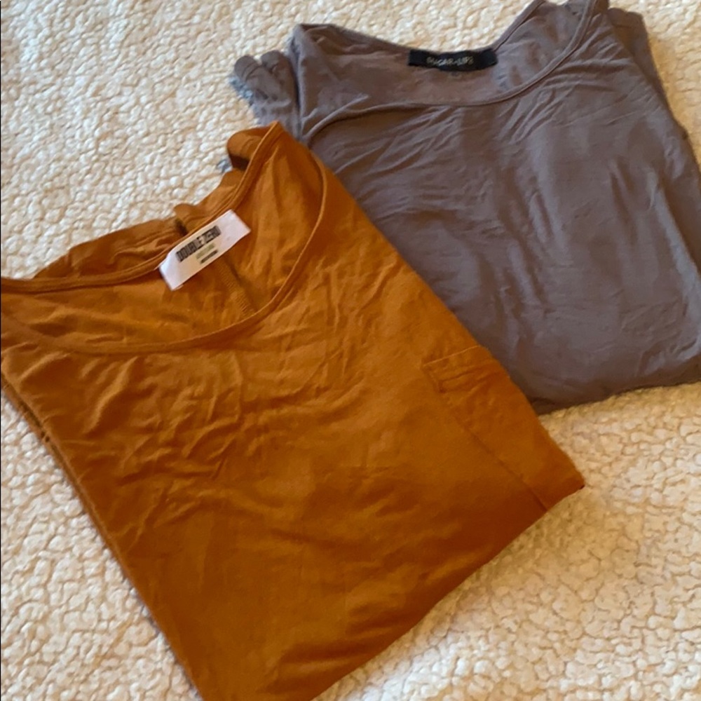 Two, beautiful long sleeved blouses are semi-new
